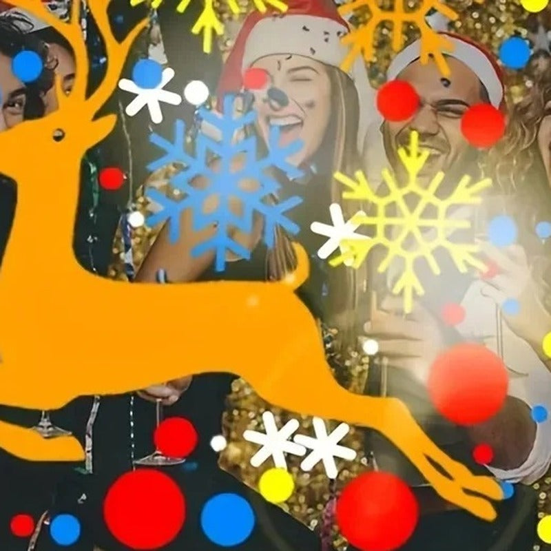 Friends at a Christmas party with a reindeer and snowflakes projected on them