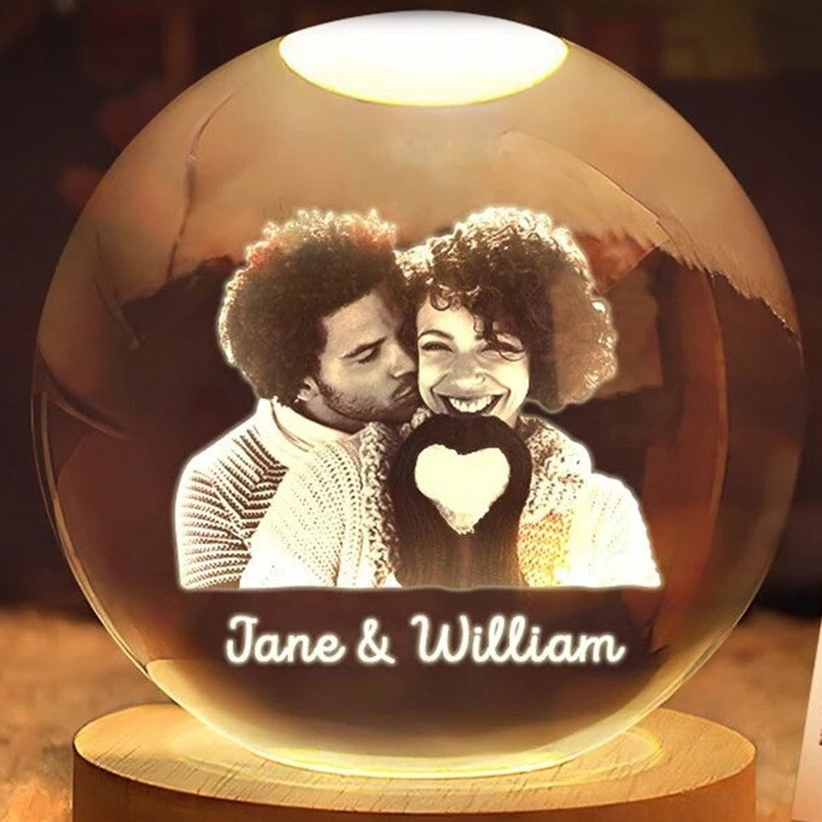 Close-up of the engraved photo and names glowing inside the crystal